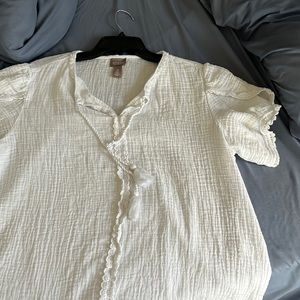 Different cute white top with tassels.